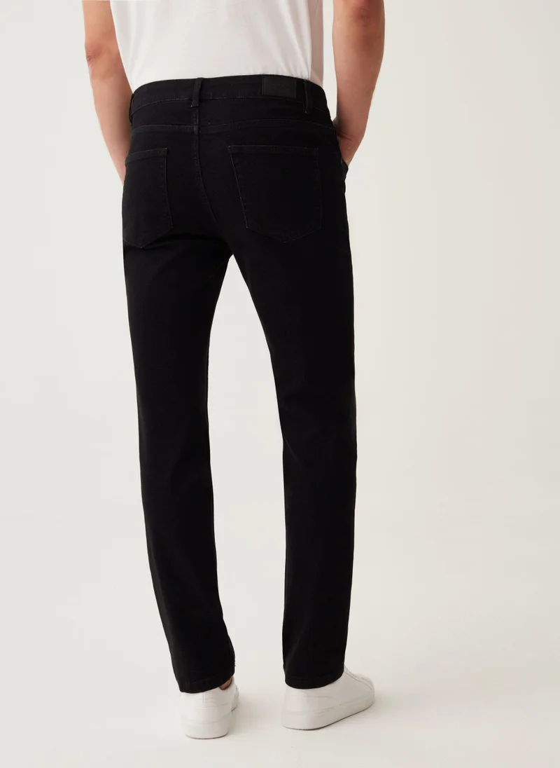 او في اس Slim-fit cross-hatch cotton jeans
