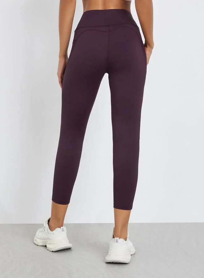 Styli Active  Women Textured Pocket Reflective Stripe 7/8 Leggings for Women | Best Price UAE