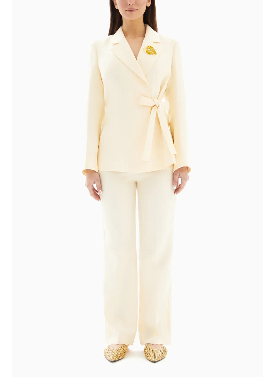 Wecre8 Cream White Set of Brooch Blazer Jacket and Trousers By WECRE8