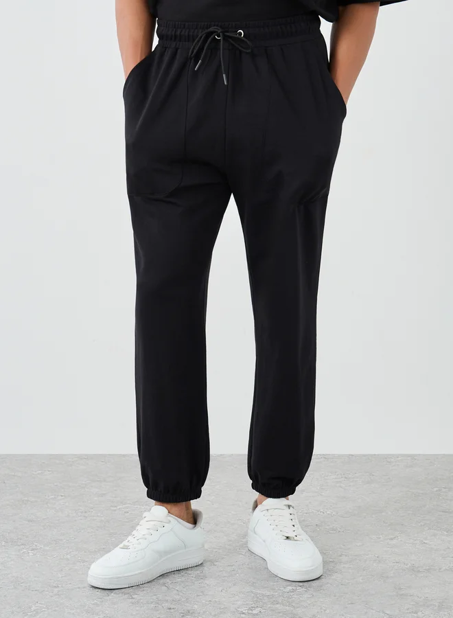 Styli Styli Pack of 2 - Solid Oversized Panelled Terry Joggers