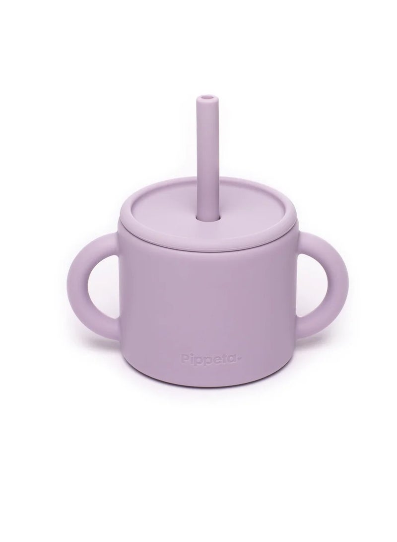 Pippeta The Pippeta Silicone Baby Cup with Straw is designed to help your baby transition smoothly to independent drinking. Its 2-in-1 design allows it to be used as both an open cup and a straw cup, supporting essential developmental skills. Made from BPA-free, food-grade silicone, it is soft, safe, and durable for everyday use. The double handles are perfectly sized for little hands, making it easy to hold and encouraging confidence. Unbreakable and easy to clean, it is both microwave and dishwasher safe. A practical and thoughtfully designed feeding essential for growing babies. - Image 1