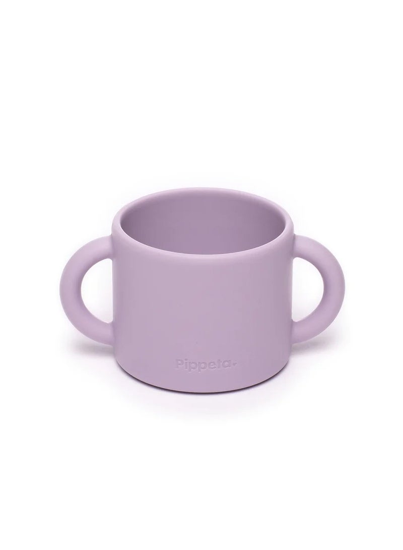Pippeta The Pippeta Silicone Baby Cup with Straw is designed to help your baby transition smoothly to independent drinking. Its 2-in-1 design allows it to be used as both an open cup and a straw cup, supporting essential developmental skills. Made from BPA-free, food-grade silicone, it is soft, safe, and durable for everyday use. The double handles are perfectly sized for little hands, making it easy to hold and encouraging confidence. Unbreakable and easy to clean, it is both microwave and dishwasher safe. A practical and thoughtfully designed feeding essential for growing babies. - Image 2