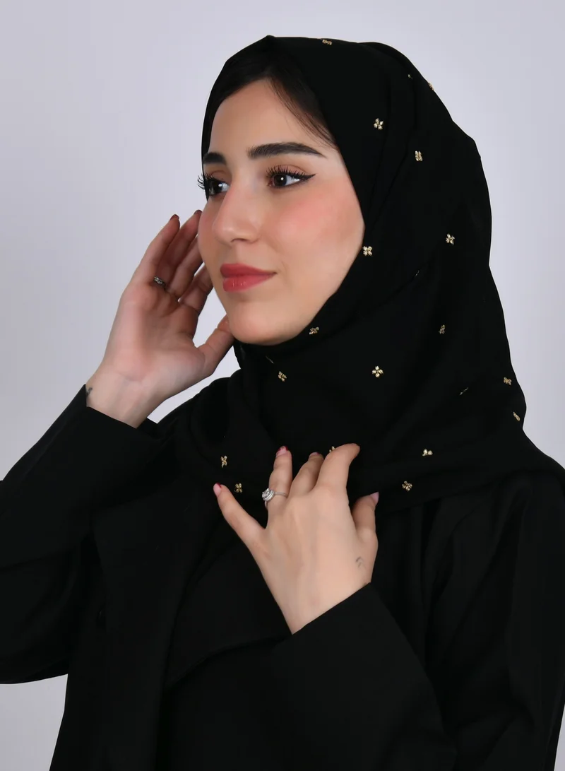 HAWRAA ABAYA A black silk veil with scattered small golden flowers