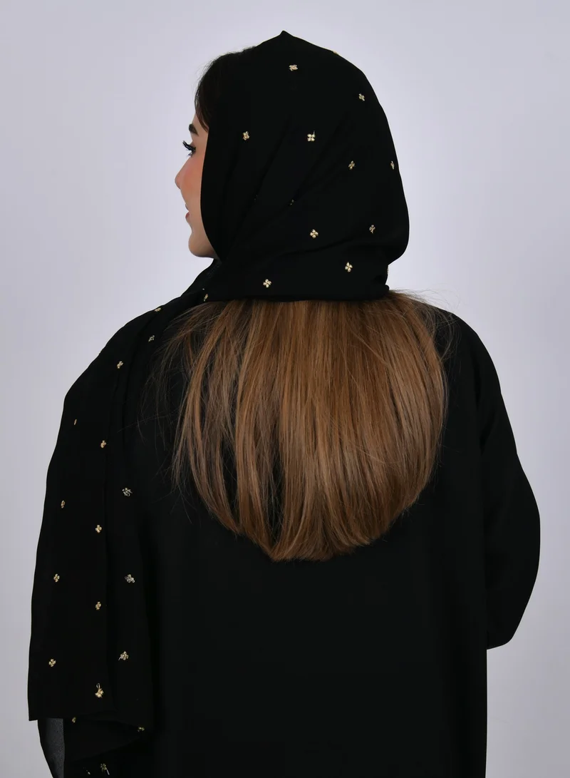HAWRAA ABAYA A black silk veil with scattered small golden flowers