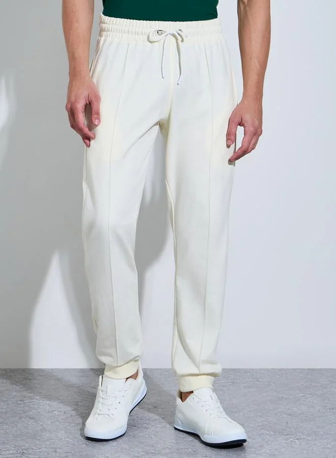 ستايلي Men Cream Solid Slim Fit Cuffed Joggers