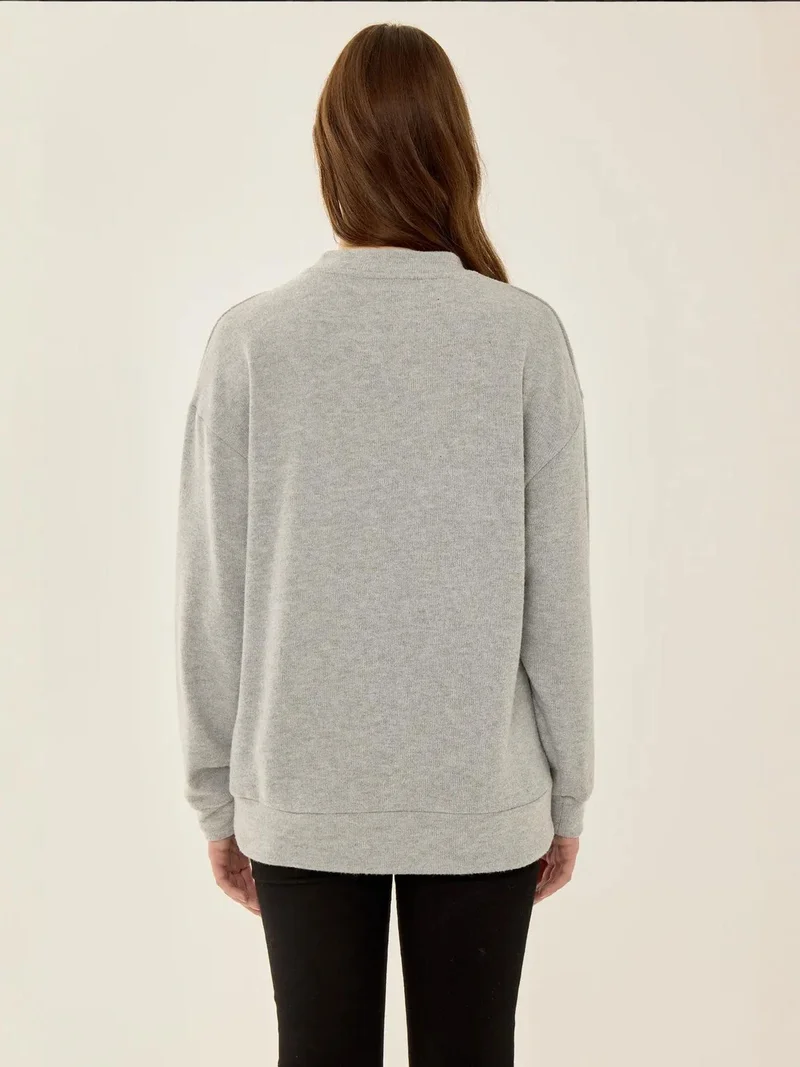 زوبعة كنزة أساسية بقصة مريحة