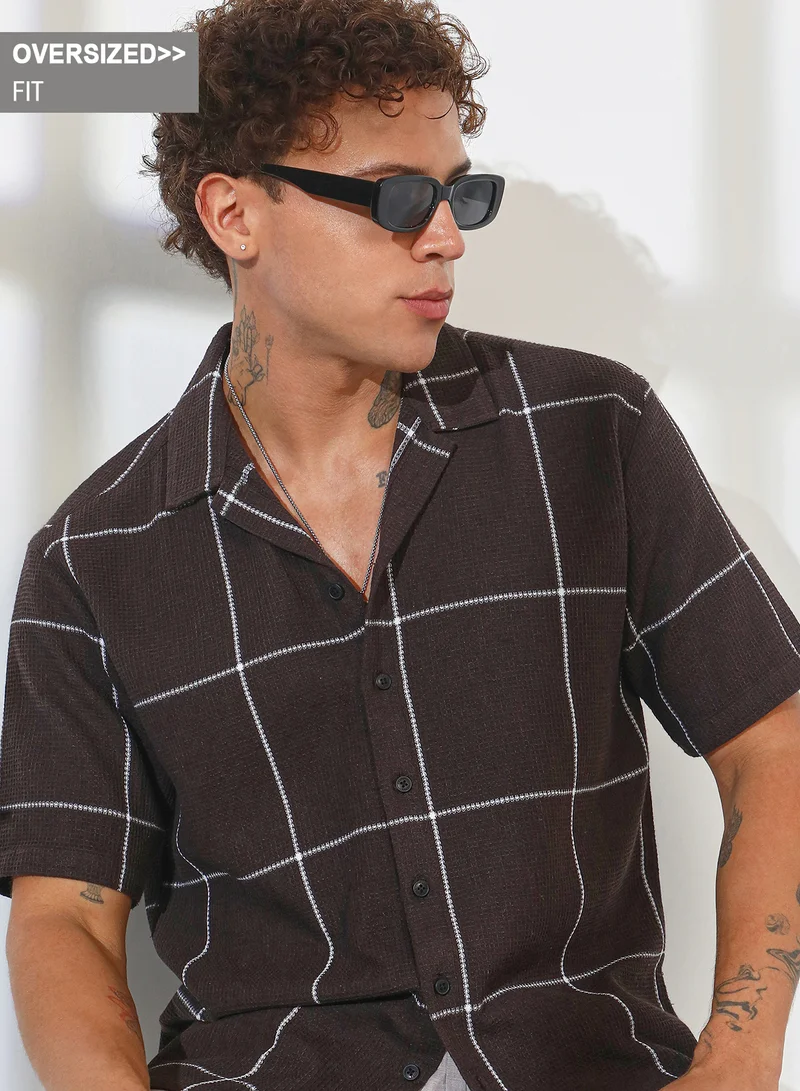 Campus Sutra Campus Sutra Men's Taupe Brown Graph Check Oversized Shirt For Casual Wear | Cuban Collar | Short Sleeve | Button Closure | Oversized Shirt Crafted With Comfort Fit For Everyday Wear
