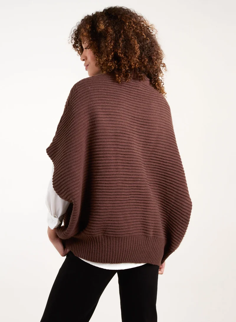 بلو فانيلا كنزة بياقة عالية مقاس كبير مضلعة