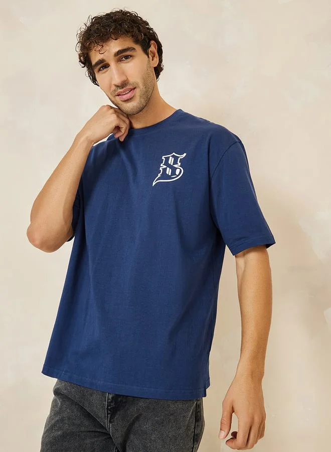 ستايلي Calligraphic Print Compact Jersey Oversized T-Shirt