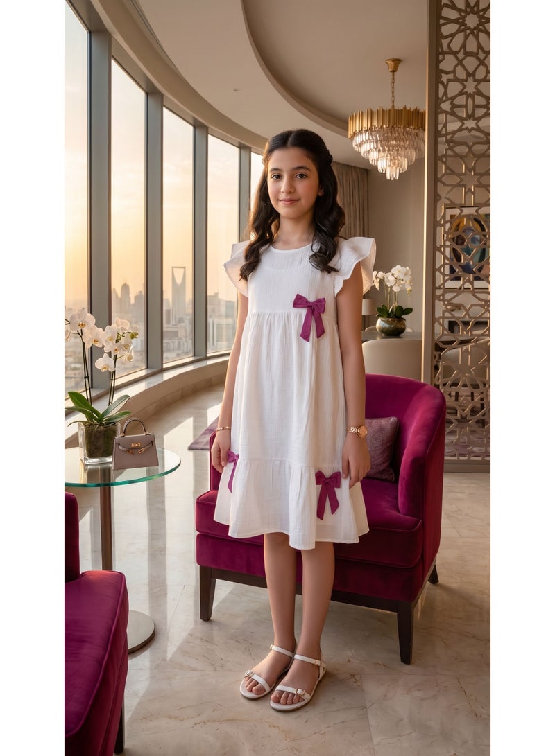Girls' Pure White Flowy Textured Dress with Contrasting Bow Details