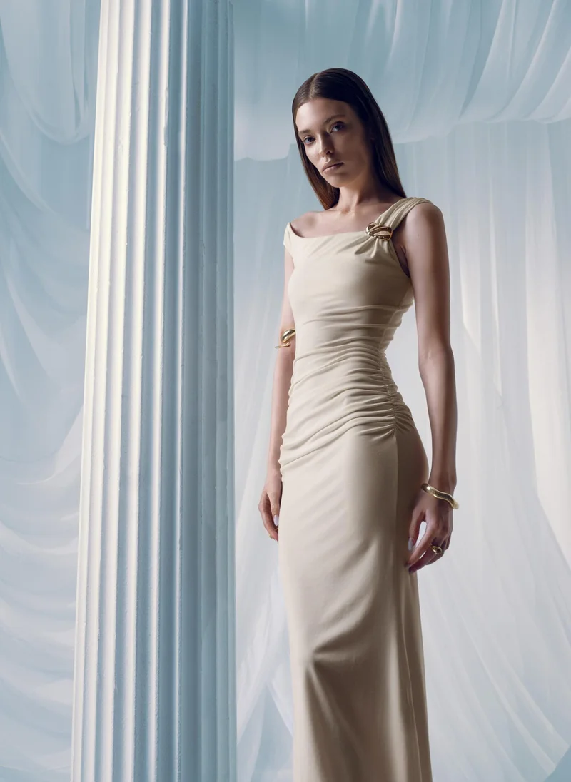 Lichi Maxi dress with asymmetrical straps and golden decor