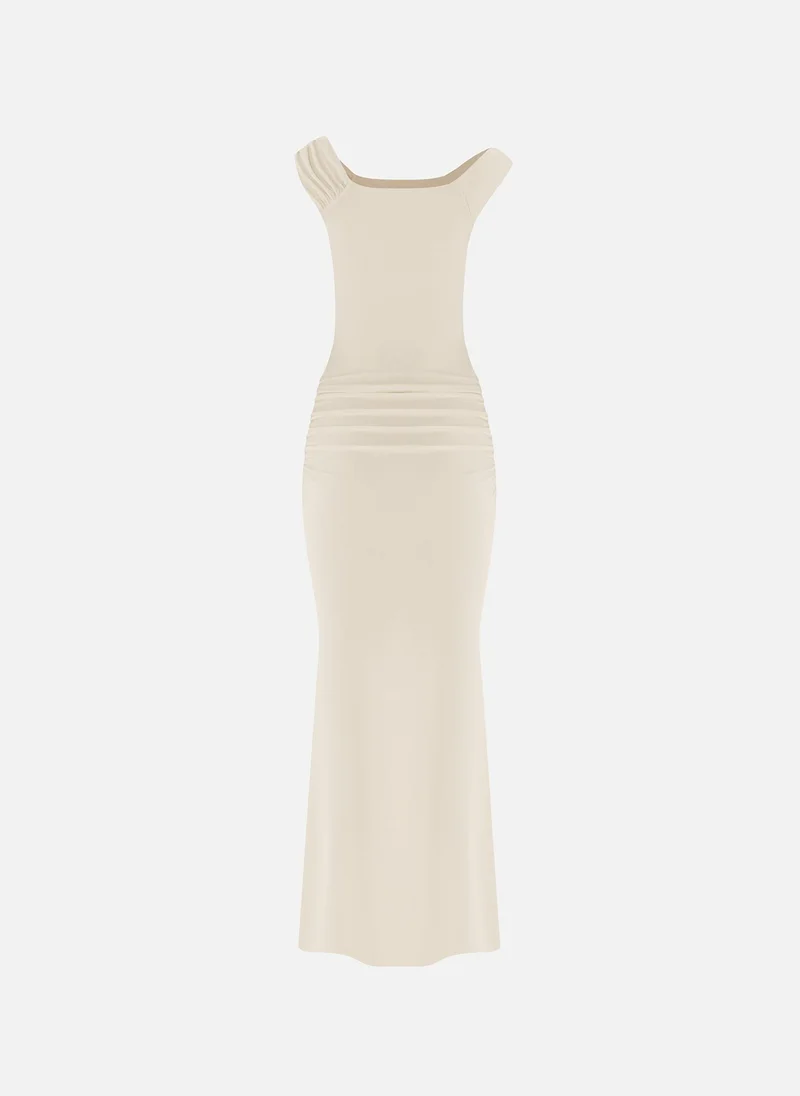 Lichi Maxi dress with asymmetrical straps and golden decor
