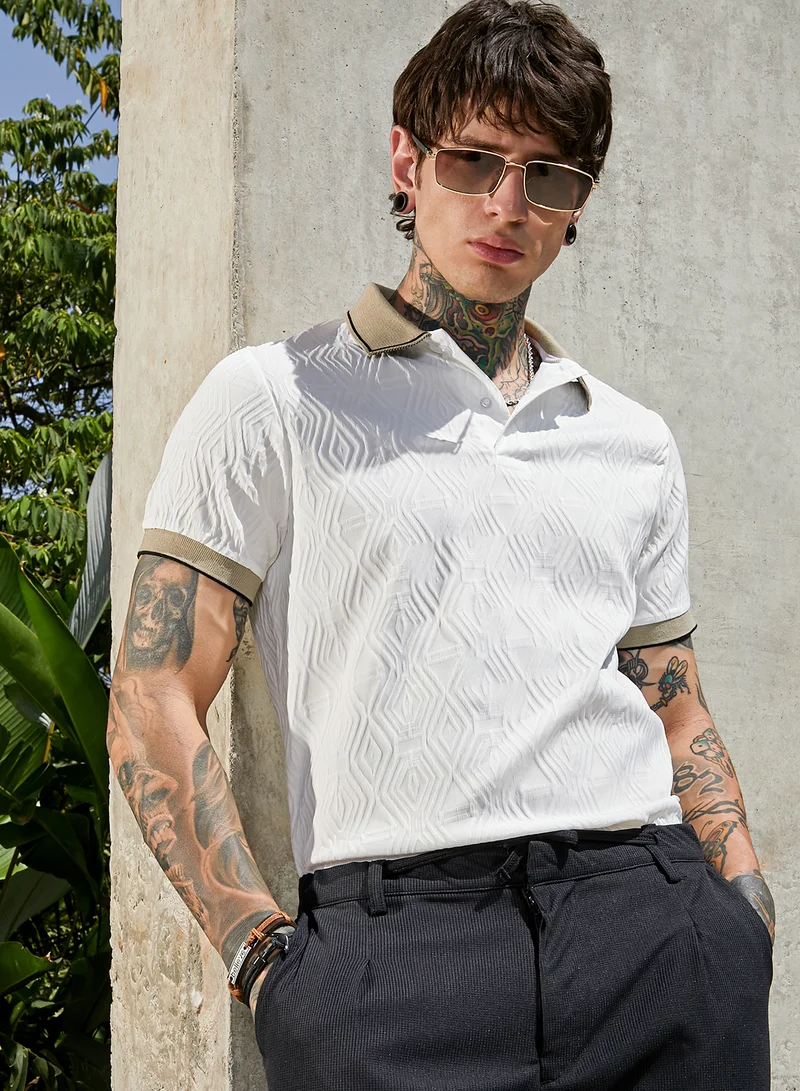 كامبوس سوترا تيشيرت بولو رجالي أبيض طباشيري وزيتوني بنقشة ربل لوغنز للارتداء الكاجوال