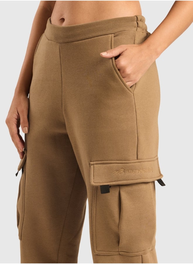Musclemind Women's Cloud Ease Fleece Cargo Pants with Super Soft And Stretchable Fabric, 6 Deep Pockets, Hidden- Inner Drawstrings, Anti-Pill, Shape Retention, Long-Lasting Colour, Super Soft And Breathable Fabric, Along with Temperature Regulation Tech  - Image 3