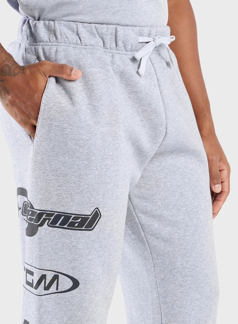 ذا جيفينج موفمنت Relaxed Fitted Racing Printed Sweatpants