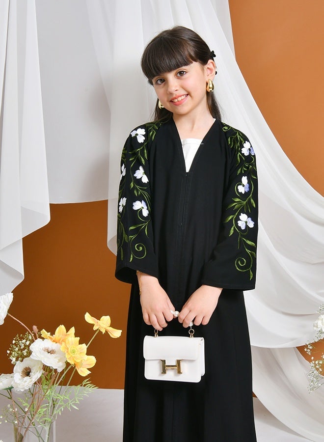 HAWRAA ABAYA Jourie Abaya | Black, closed with snaps, decorated with embroidery on the sleeves - Image 1