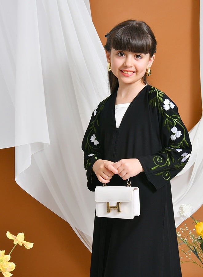 HAWRAA ABAYA Jourie Abaya | Black, closed with snaps, decorated with embroidery on the sleeves - Image 4