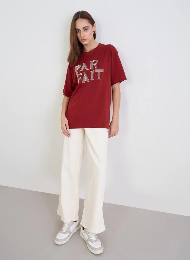 Styli  Styli Red Slogan Print Oversized T-Shirt for Women | Best Price UAE