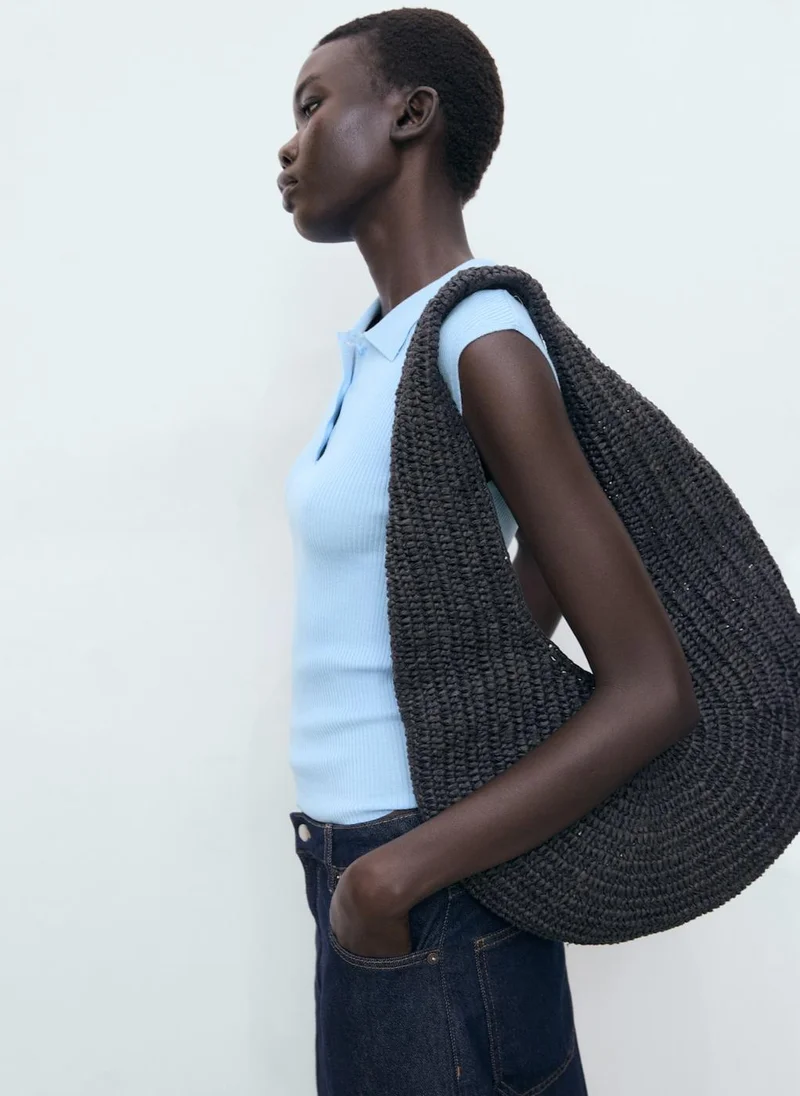 مانجو بلوزة بياقة بولو محبوكة