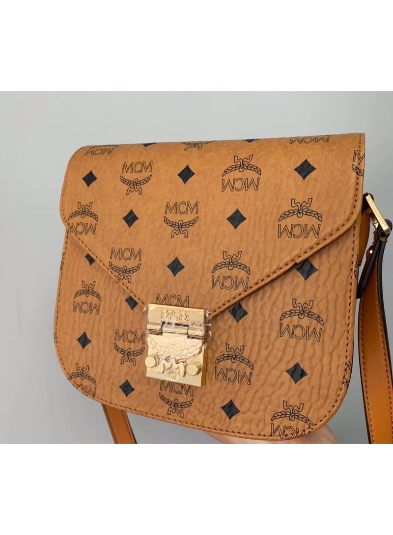 MCM Brown Monogrammed Saddle Crossbody Bag with Gold-tone Lock and Adjustable Strap