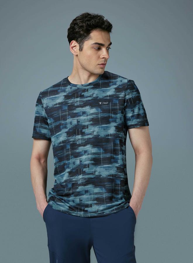 تكنوسبورت تيشيرت تكنوسبورت بقصة ضيقة وطبعة شاملة - Image 1