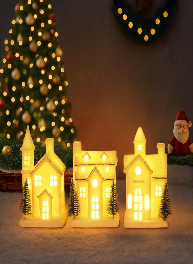 Dlfghos Ceramic White Christmas Village Houses 3Pcs Light Up Small Porcelain Village House with 4Pcs Christmas Trees LED Lighted Tabletop House Figurines Christmas Decorations for Holiday Winter Home Decor - Image 1