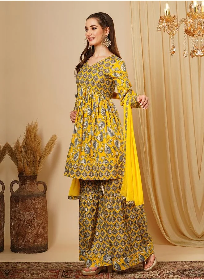 جلو باص Globus Women Mustard Allover Floral Print Alia Cut Knee Length Kurta With Sharara & Dupatta Festive Wear Set by Styli