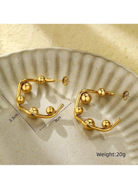 Geometric gold earrings with striking designs, adding a modern and stylish touch to any look