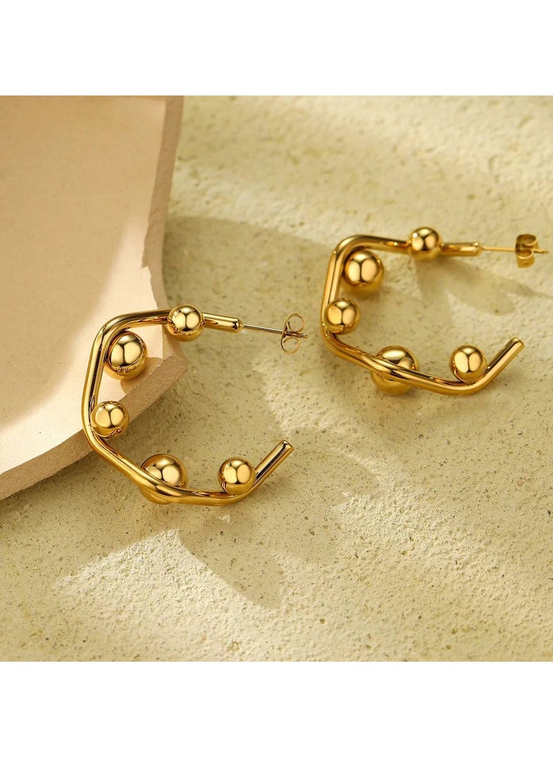 Geometric gold earrings with striking designs, adding a modern and stylish touch to any look