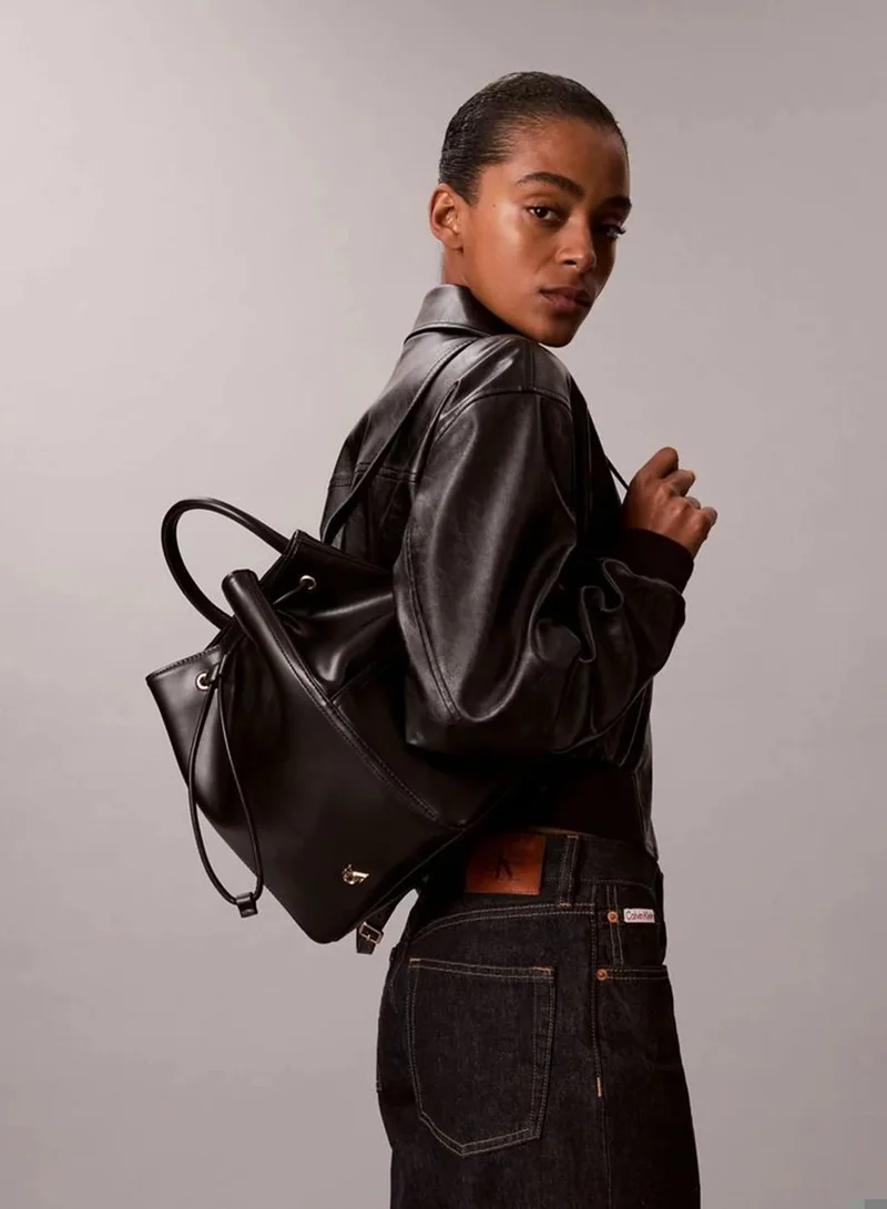 Calvin Klein BLACK / ANTIQUE LIGHT GOLD Monogram Drawstring Backpack for Women | Best Price UAE