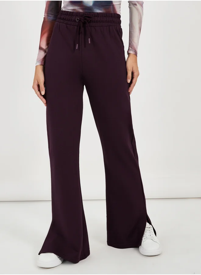 Styli Solid Drawstring Waist Flared Joggers with Side Slit