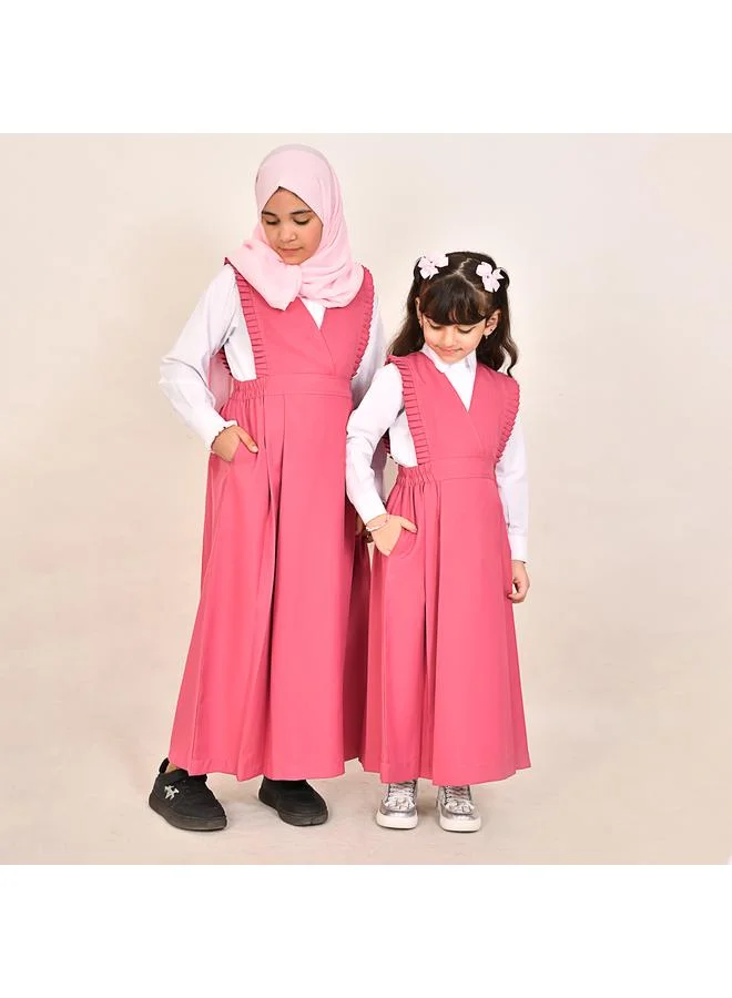 HAWRAA ABAYA مريول وردي بقصة مثلثه وكشكش ناعم وزم من الجانبين-ابتدائي