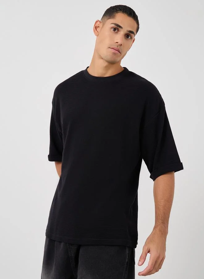 Styli Styli Waffle Knit Oversized T-Shirt with Turn-Up Sleeves