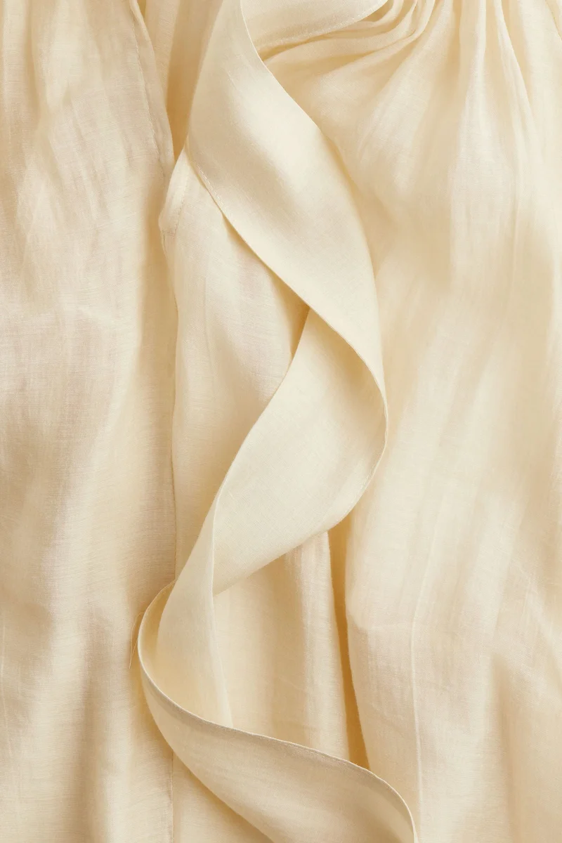 اتش اند ام بلوزة شفافة برباط على القبة