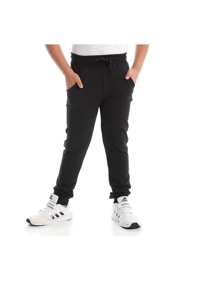 Modern trousers with side pockets in black, heavy-duty diving fabric, sizes 9-10 years - Image 1