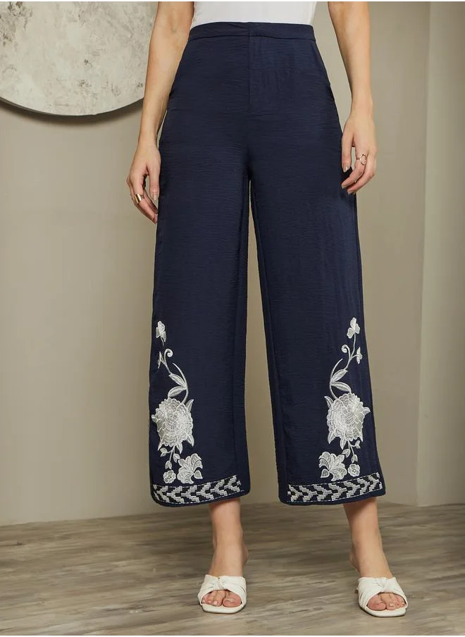 Styli Embroidered Hem Mid Rise Ankle Wide Leg Pants