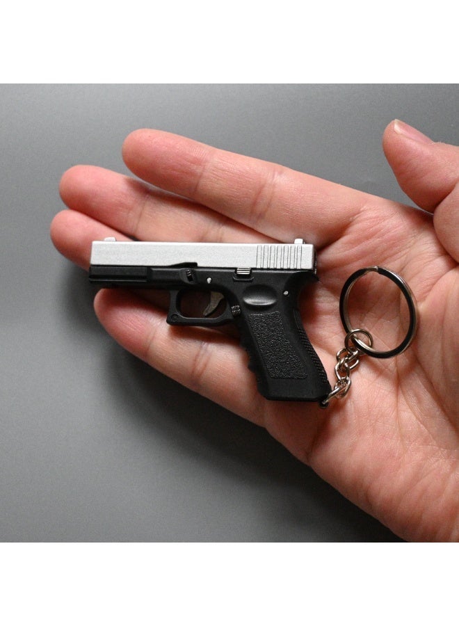 Mini Metal Gun Shape Key Chain - Image 1