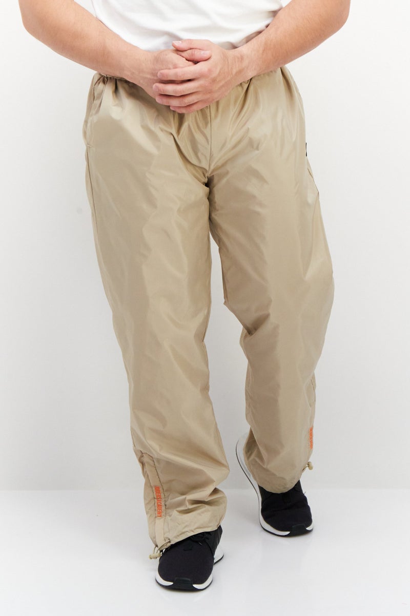 FILA Men Sportswear Fit Brand Logo Training Track Pants, Beige - Image 1