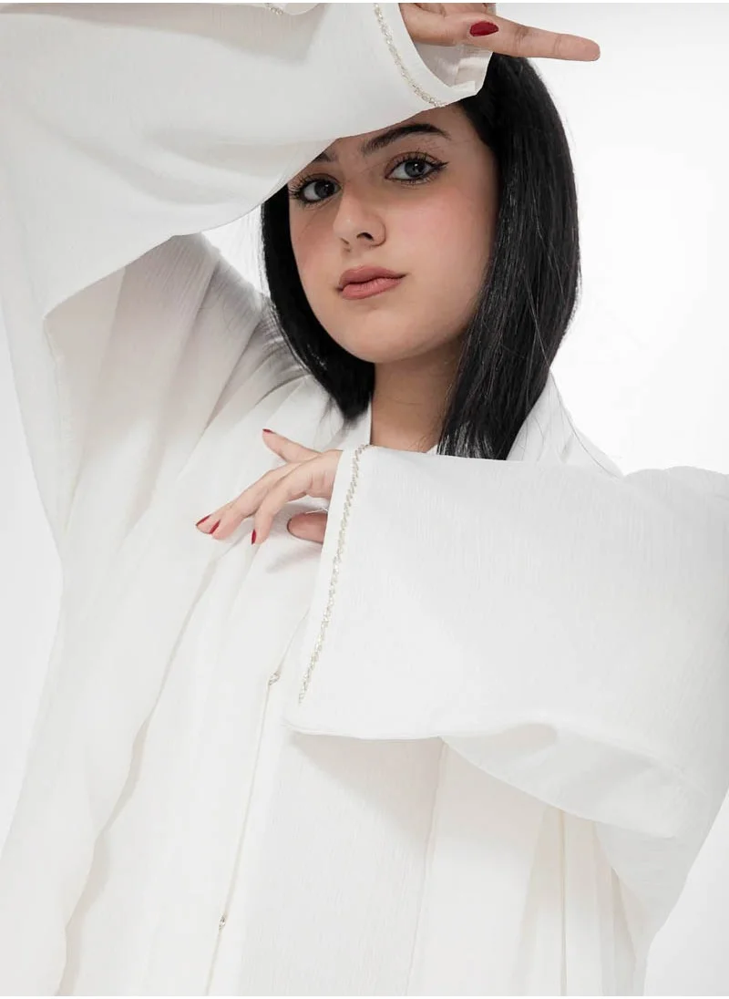 Aara Off White Abaya with Pleats and Gold Embellishments
