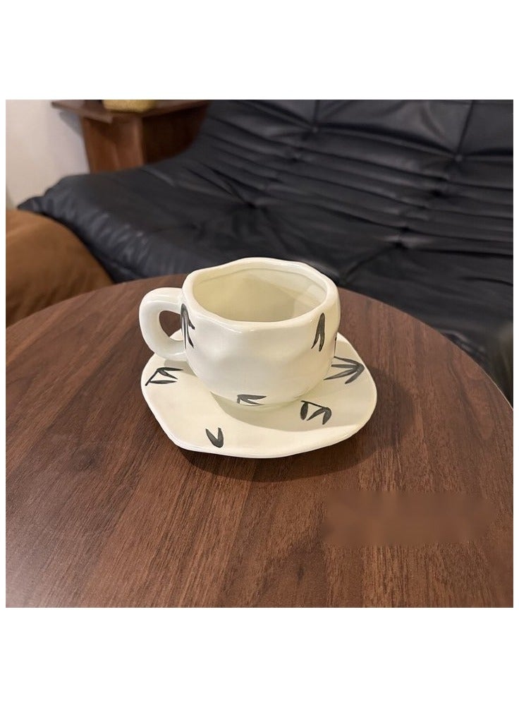 White ceramic coffee mug with black decoration - elegant and modern - Image 1