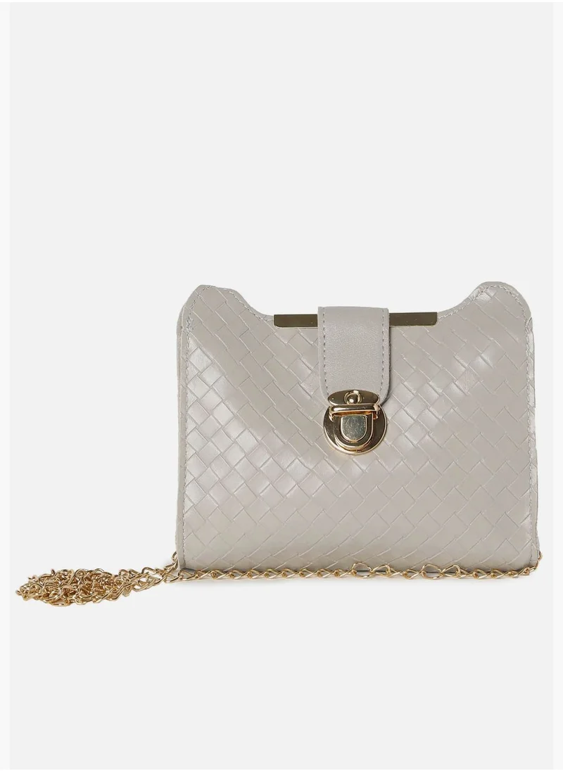 Haute Sauce Textured Push Lock Sling Bag with Chain Strap