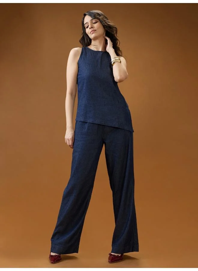 جلو باص بنطلون جينز نسائي واسع الساق بخصر متوسط وطيات باللون الأزرق الداكن