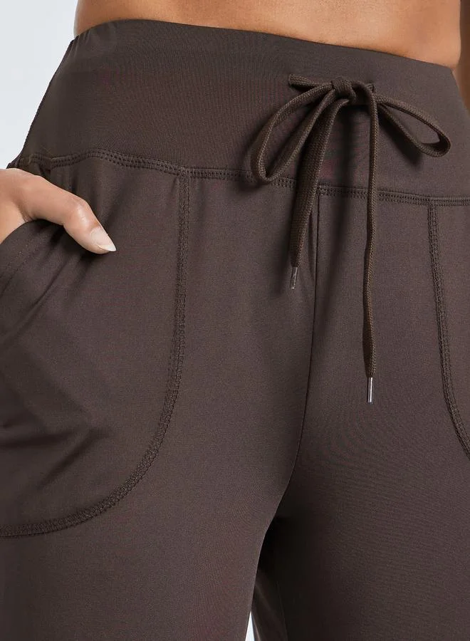 Styli Active  Brown Broad Waist Tie and Pocket Detail Loose Straight Pants for Women | Best Price UAE