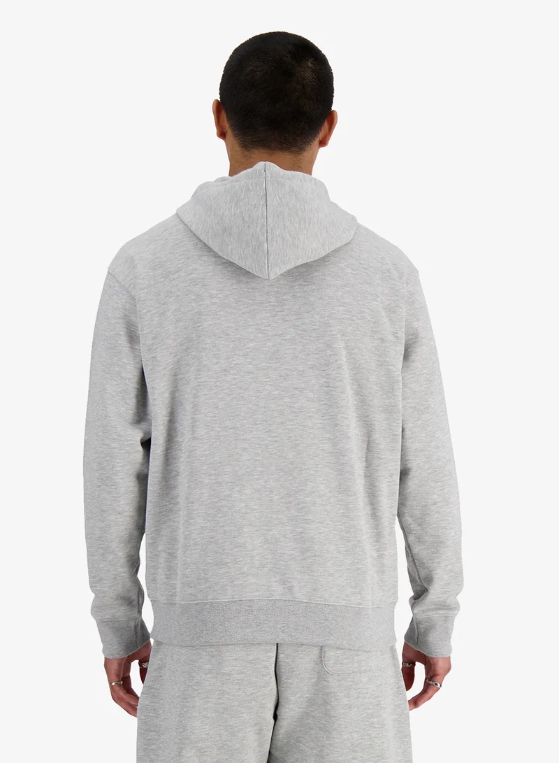 نيو بالانس هودي أساسي بشعار من نسيج تيري الفرنسي