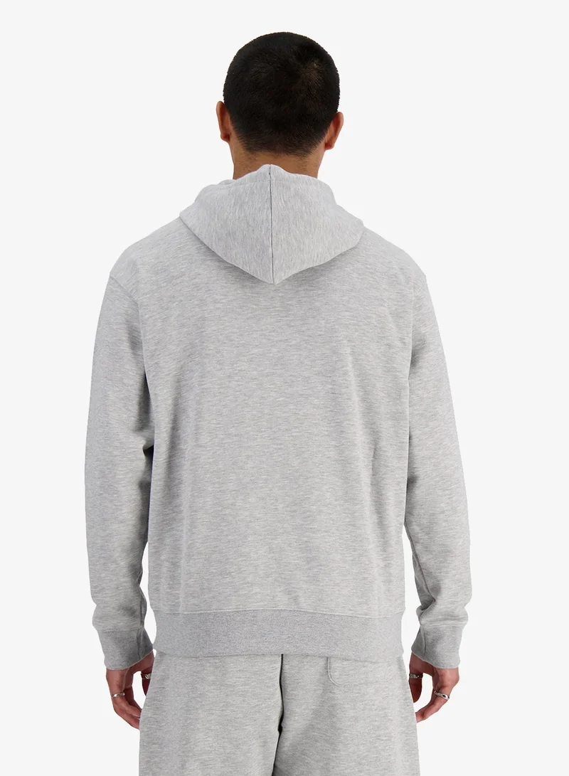 نيو بالانس هودي أساسي بشعار من نسيج تيري الفرنسي