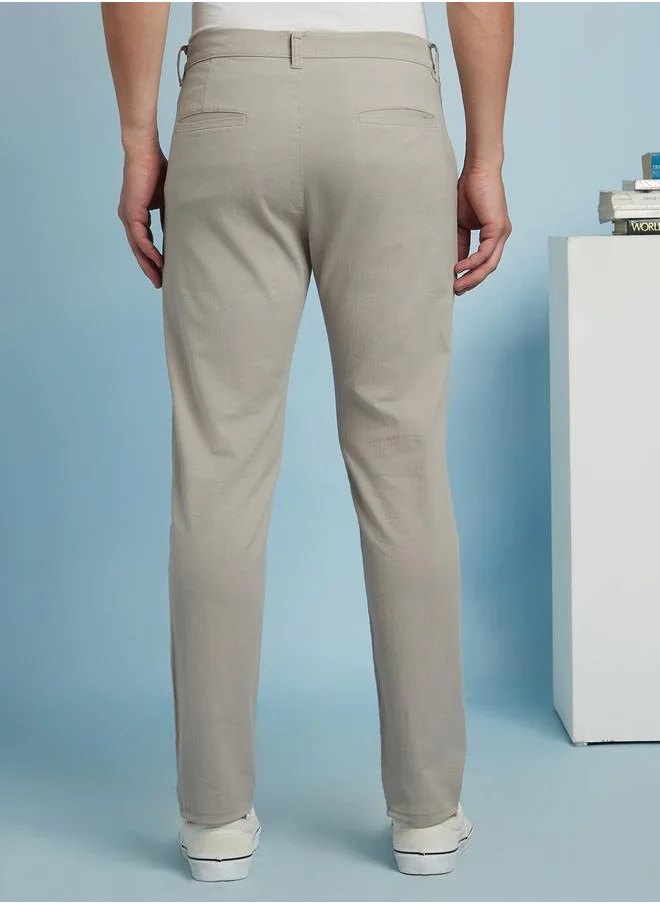 دينيس لينغو Sleek Light Grey Straight Fit Chinos for Men with a mid-rise fit, coin pocket detailing, and a soft yet durable cotton-lycra blend for effortless styling.