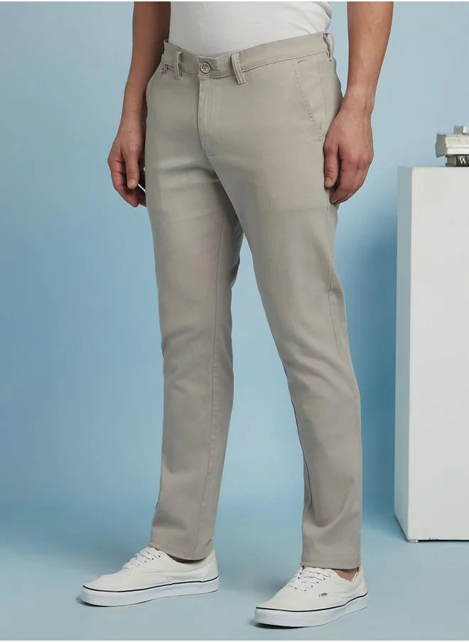 دينيس لينغو Sleek Light Grey Straight Fit Chinos for Men with a mid-rise fit, coin pocket detailing, and a soft yet durable cotton-lycra blend for effortless styling.