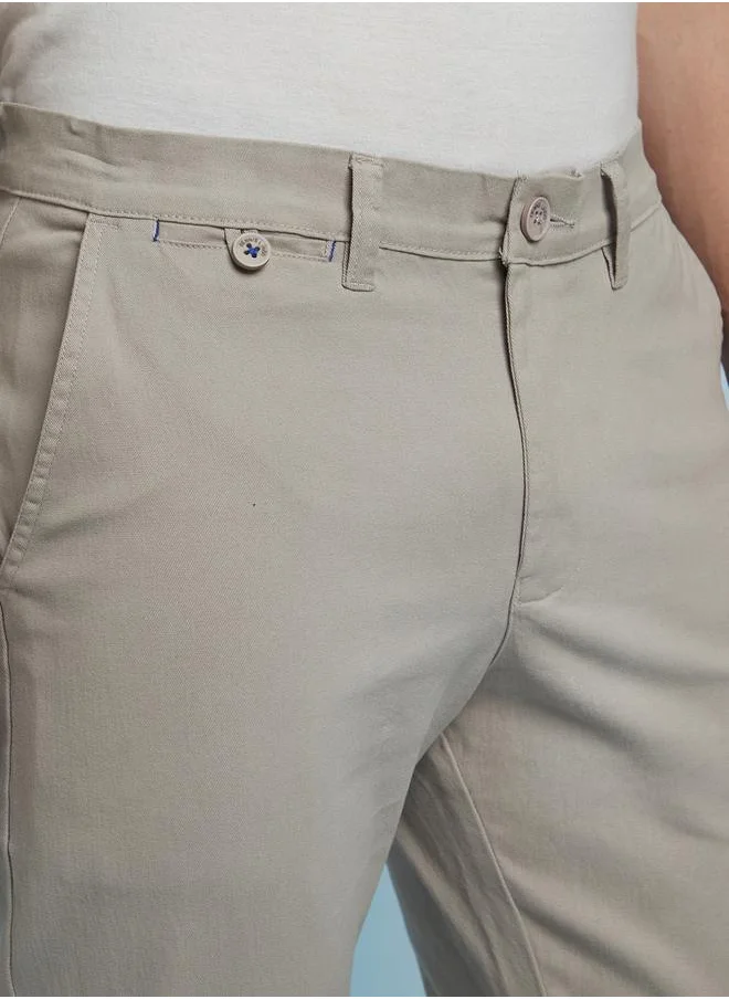 دينيس لينغو Sleek Light Grey Straight Fit Chinos for Men with a mid-rise fit, coin pocket detailing, and a soft yet durable cotton-lycra blend for effortless styling.