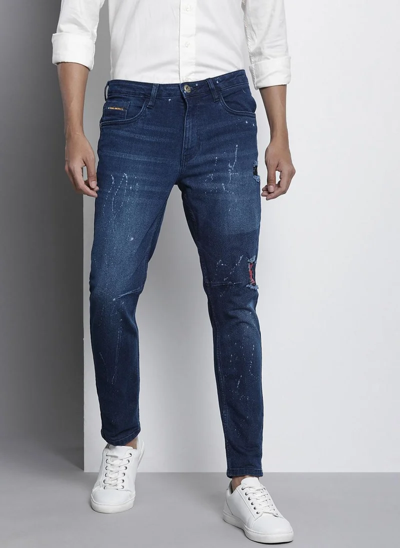 Men Carrot Fit Distressed Mid-Rise Stretchable Jeans