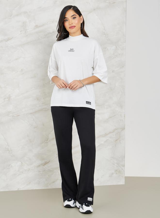 Styli Printed High Neck Drop Shoulder T-shirt and Flared Co-ords - Image 1